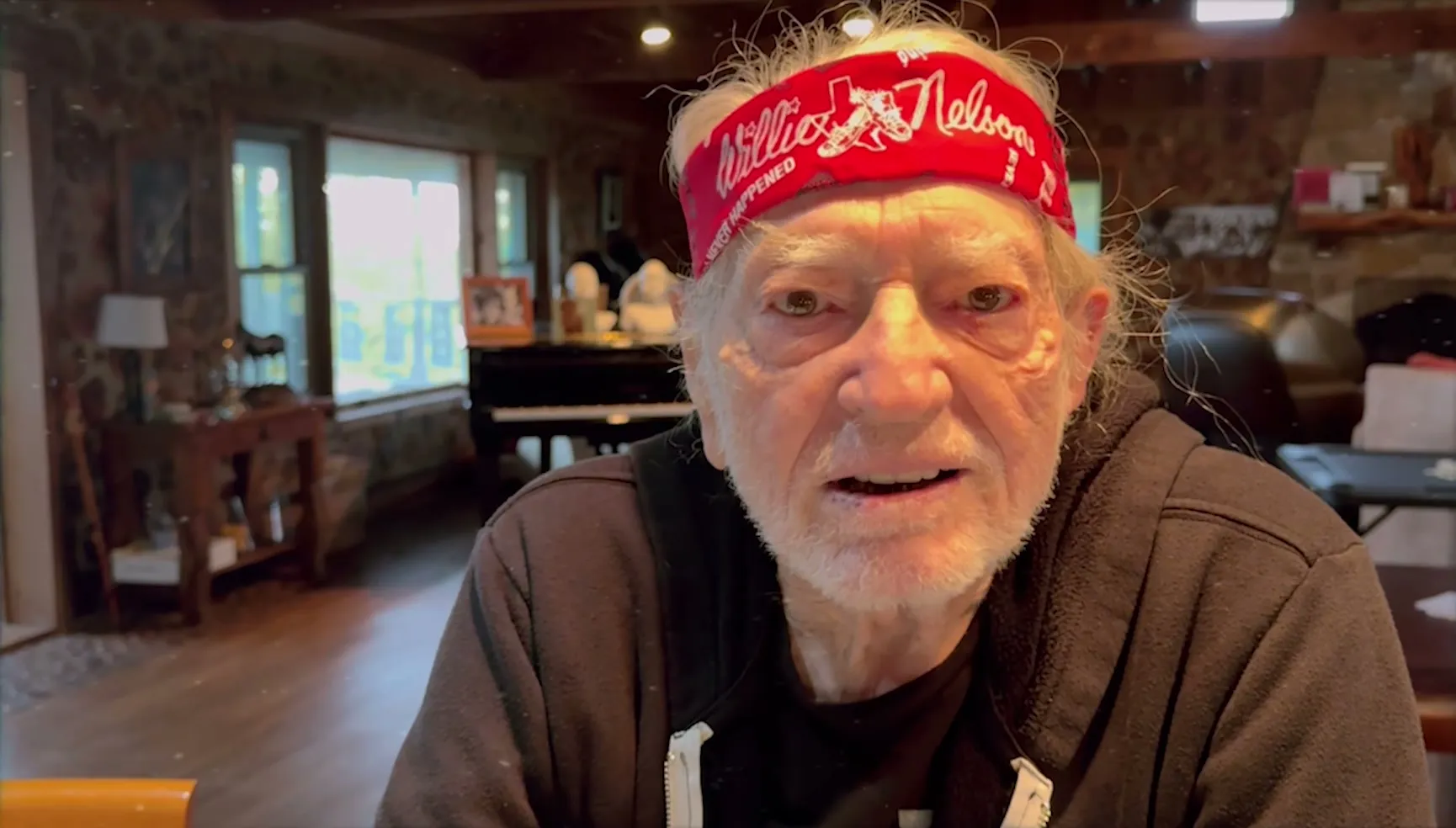 Willie Nelson, in his red bandana, saying hello to CERN